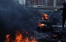 Irak'ın Necef kentinde göstericiler İran Başkonsoluğunu ateşe verdi